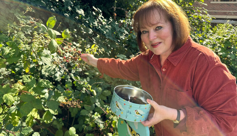 Angela picking her own Blackberries
